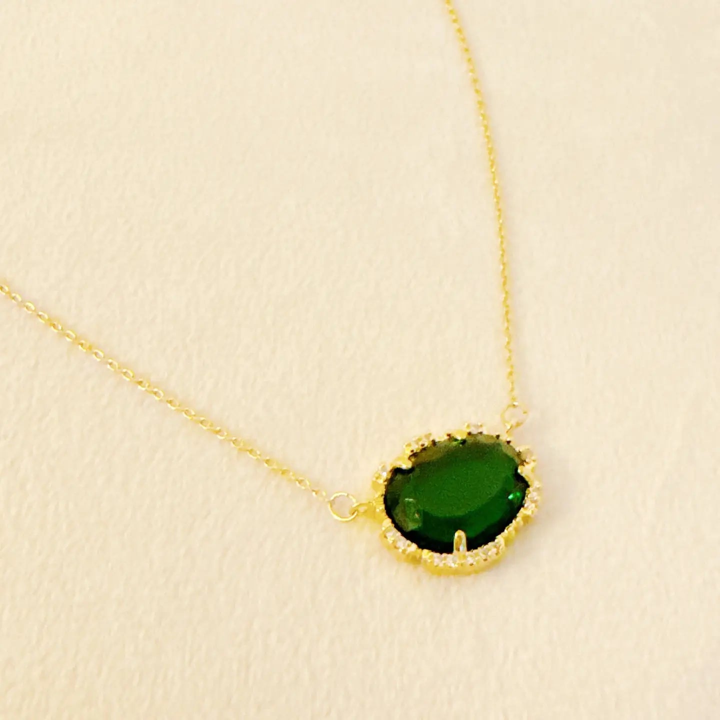 Culbreth's Jewelers emerald glass jewel pendant necklace on display